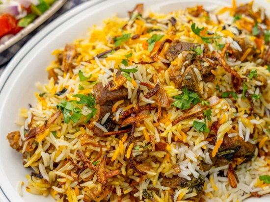 Mutton biryani with yogurt salad